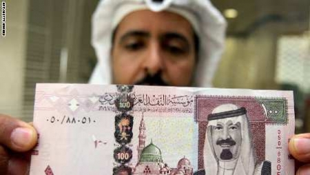 باحث سعودي يرفض انتقادات رجال الدين لاكتتاب البنك الأهلي ويهاجم من يتركه ‘‘ تورعا‘‘